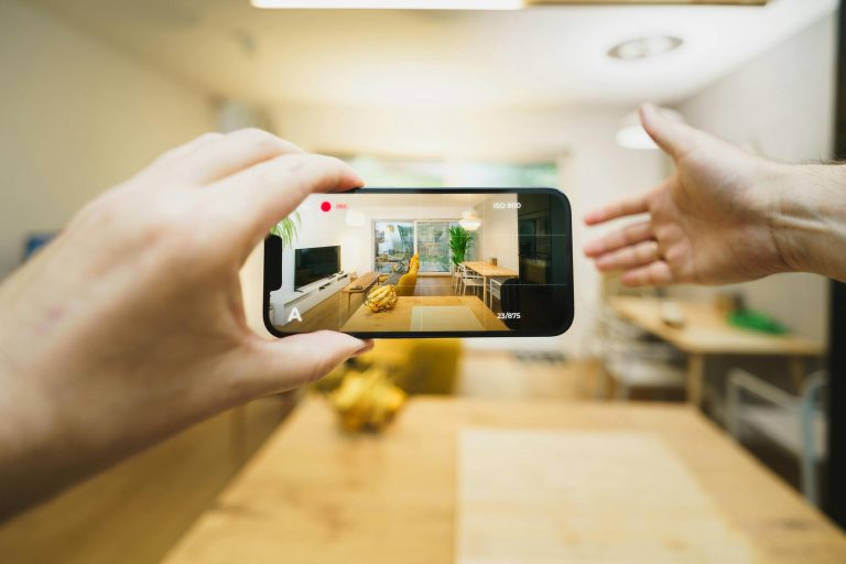 Interactive virtual tour of a contemporary living room using a smartphone.